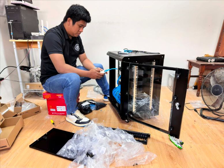 Crispolo installing network cabling and hardware